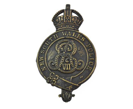An Edward VII New South Wales Police Helmet Plate, in blackened die stamped brass with King's crown over garter and EVIIR cyp
