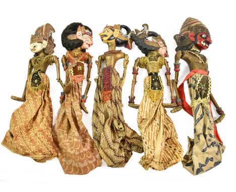  A Set of Five Javanese Wayang Golek Wood Puppets, with white and pink refined and semi-refined faces, wearing printed cotton