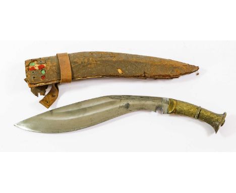 An Indian Large Kukri, the 34.5cm curved steel blade with engraved decoration to the short fuller, with brass bolster and gri