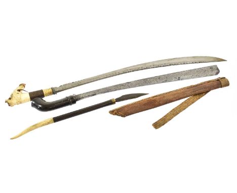 A Dyak Mandau (Head Hunter's Sword), Borneo, the 62cm single edge curved steel blade pierced and inlaid with circular motifs 