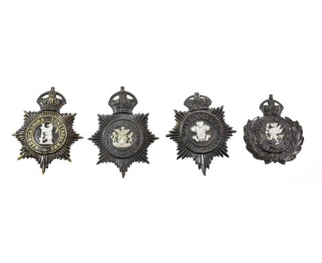 Four Blackened Die Stamped Brass Helmet Plates, each with King's crown over star, circlet and white metal coat of arms, to:- 