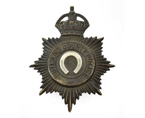A Rutland County Police Helmet Plate, in blackened die stamped brass with King's crown over a star, circlet and applied white