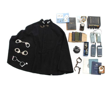 A Quantity of Police Memorabilia, including a wool cape with chrome numbers 804, a boxed pair of Smith &amp; Wesson handcuffs