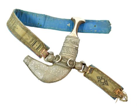 A 19th Century Omani Khanjar, the 16cm double edge curved steel blade with raised medial ridge, the rhinoceros horn grip with