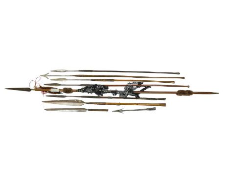 Five South African Spears, one with barbed head and four with small leaf shape head, long tangs inserted into the wood hafts 