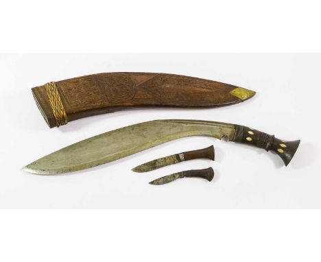 An Indian Large Kukri, the 39.5cm curved steel blade with two narrow fullers to the back edge, steel bolster, hardwood grip i