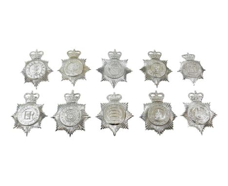 Ten Elizabeth II Police Helmet Plates, in chromium plated die stamped metal, with QEII crown over star, circlet and coat of a