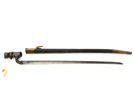 A P1853 Enfield triangular socket bayonet, the blade with Enfield ordnance stamps, in its brass mounted leather scabbard. GC 