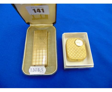 A Dunhill lighter and a fob watch