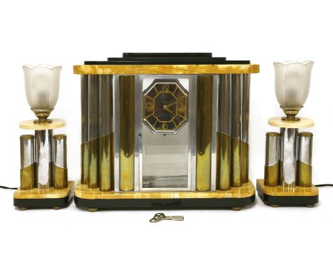 An Art Deco marble and chrome mantel clock garniture,the chrome and brass mounted columns flanking an octagonal dial with bra