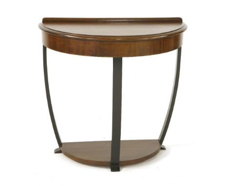 An Art Deco walnut console,of demilune shape with ebonised supports,76.5cm wide39.5cm deep70.5cm high
