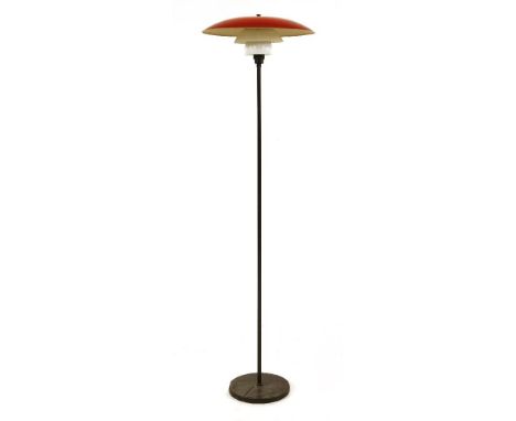 A PH 3.5 lamp,designed by Poul Henningsen, with a red enamelled shade and two further shades, one cracked, 157cm high