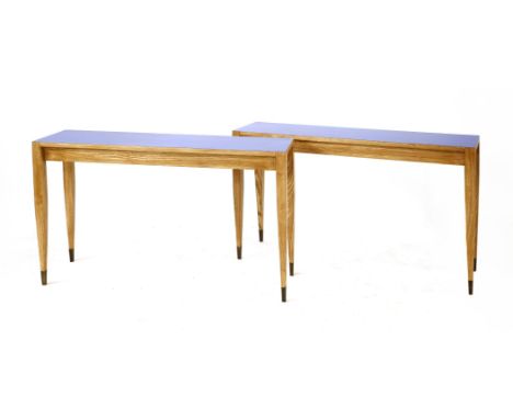 A pair of Italian ash and laminated blue console tables, c.1960, designed by Gio Ponti for Parco dei Principi Hotel, with bra