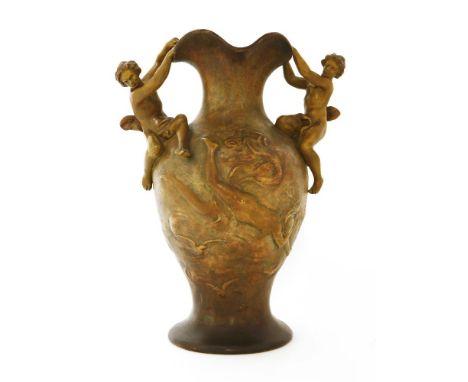 A Goldscheider terracotta vase,moulded with a maiden plunging through the sky to the body, two figures clinging to the shaped