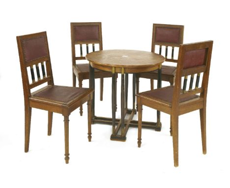 A Secessionist circular oak inlaid table, centred with a rosewood mother-of-pearl plaque, over turned ebonised legs, with bra