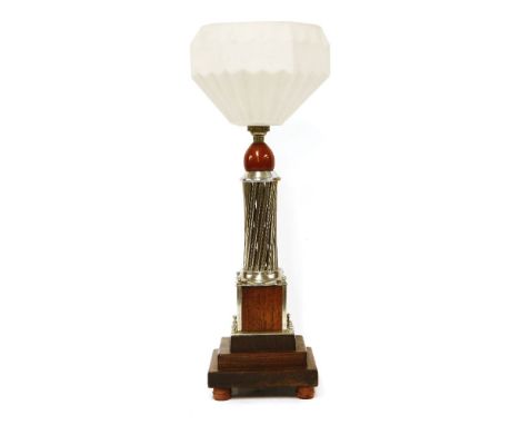 An Art Deco silver and mahogany table lamp,with a moulded shade,50cm high