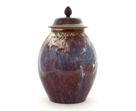 A Ruskin high-fired flambé vase and cover, 1906, in purple and white with turquoise specks, with domed cover and finial, impr