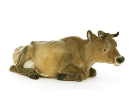 A Royal Copenhagen Jersey cow,modelled by Vivian Jeanne Grut, numbered '4683' and printed marks,22.5cm long