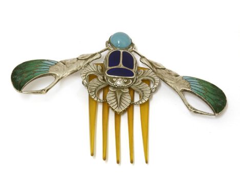 An Art Nouveau enamelled hair comb,by Piel Frères, modelled with a scarab beetle and cranes, with a horn hinged comb,13.7cm w