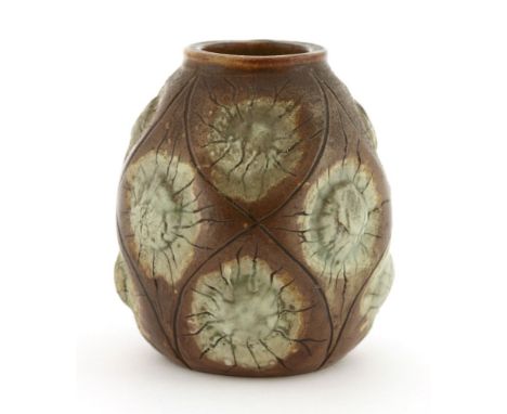 A Martin Brothers' stoneware vase,moulded with stylised flower heads within incised leaf-shaped panels, incised mark 'Martin 