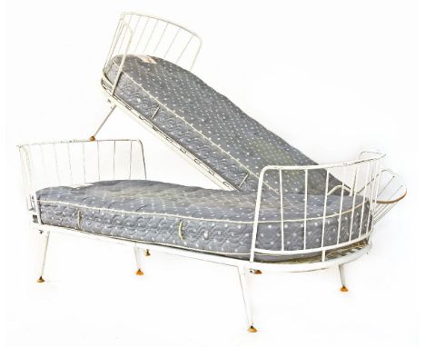 A pair of painted metal daybeds,in the style of Ernest Race, the button castors labelled 'Armstrong Cork Company',200cm wide9