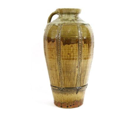 *Mike Dodd (b.1943),a glazed stoneware handled vase with vertical incised and impressed bands,43.5cm high*Artist's Resale Rig