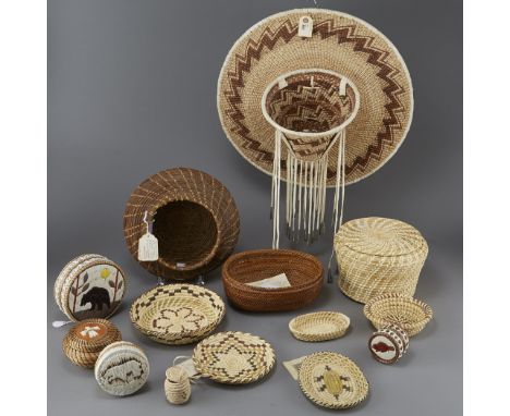 Fourteen Native American Baskets, including dishes and lidded baskets. One basket includes a tag from Warao Basketry; three i