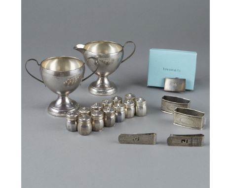 Group of 17 sterling silver objects. Includes 12 salt and pepper shakers; two napkin rings engraved "Jack" and "Albert," resp