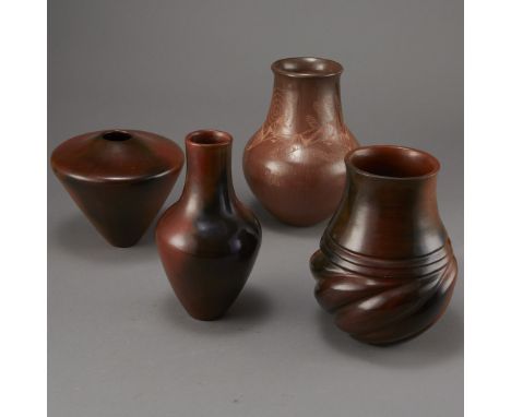 Group of four Southwestern pottery pieces which include one Samuel Manymules brownware vase with twisted body design, two Sus