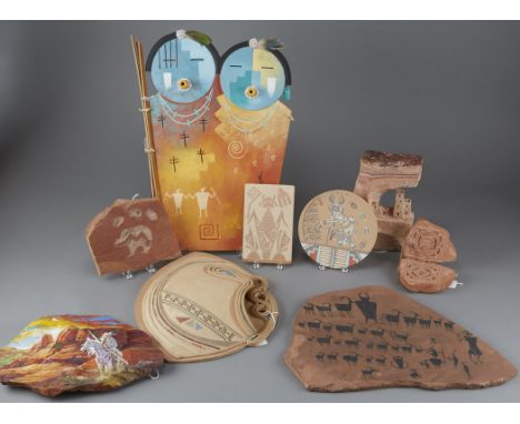 Seven pieces of rock art and wall plaques, including one painted charger signed Lyndee Sandia, one ceramic wall pocket signed