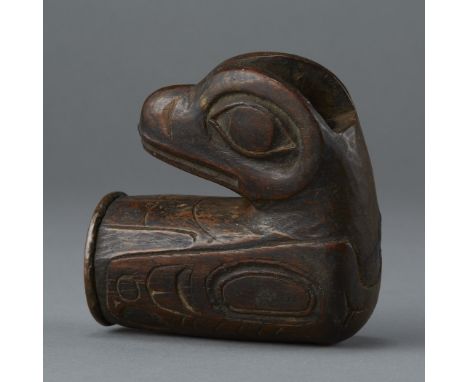 Tlingit wooden pipe depicting raven with wings and tail. Copper cap and copper bowl liner match pipes dating from c. 1820-185