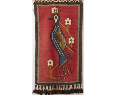 Woven wool tapestry by Olga Fisch. Large bird design with beads on red background and heavy fringe. Includes a wooden dowel f