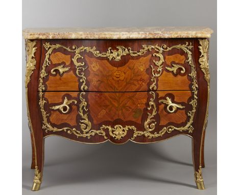 Late 19th century. A very fine Louis XV style ormolu-mounted tulipwood and amaranth marquetry commode with serpentine molded 