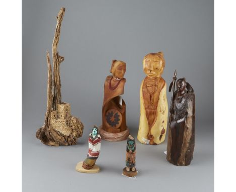 Group of seven Native American carved wood sculptures. Harry Benally (Navajo, b. 1951) sculpture titled Dine Lady. The sculpt