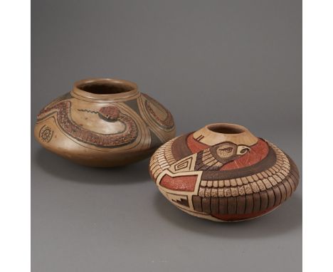 Group of two polychrome pottery bowls. One Hopi pottery seed pot with intricate and detailed carving of an eagle along the bo