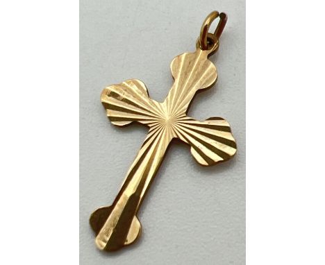 A 9ct gold vintage cross pendant with sun-ray design to front. Full hallmarks to back. Approx. 2.5cm x 1.5cm. Total weight ap