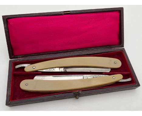 A boxed set (No. 1 &amp; No.2) of vintage Kropp cut throat razors in original red silk &amp; velvet lined display case.  With