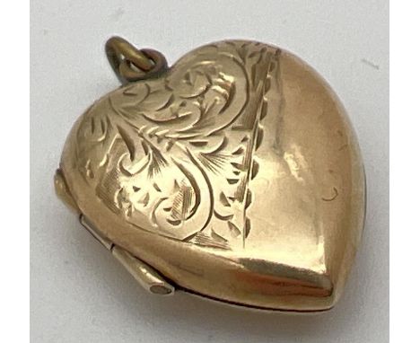 A vintage heart shaped locket with 9ct gold front and back half floral engraving to front of locket. Gold mark to back. 2.5cm