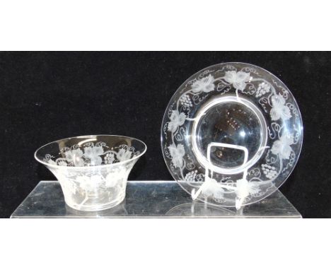 A SET OF FOUR GLASS BOWLS  and six matching saucers, engraved with grapes and vines, the bowls 12cm diameter, the saucers 16c