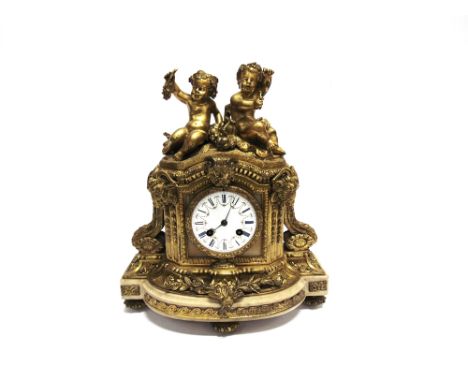 A GILT METAL MOUNTED 8-DAY MANTLE CLOCK  with twin cherub surmount, the enamel dial inscribed 'CHles FRODSHAM PARIS', 29cm wi