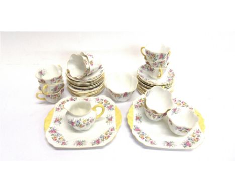 A SHELLEY PART TEA SERVICE  decorated with roses on a trellis, comprising pair of sandwich plates, milk jug, sugar bowl, twel