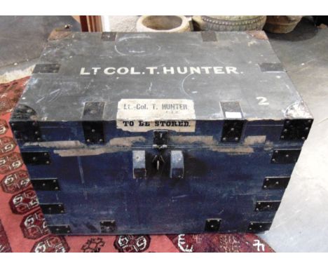 A METAL BOUND PAINTED PINE TRUNK  labelled and painted 'LT. COL. T. HUNTER' to lid, 76cm wide 50cm deep 53cm high