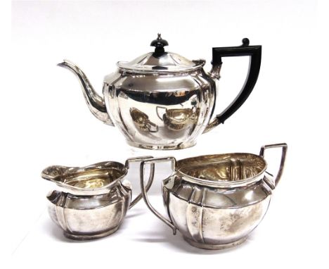 A SILVER THREE PIECE TEA SERVICE  by William adams Ltd, Birmingham 1835, of oval outline with canted corners, 1.228g (39.6 tr