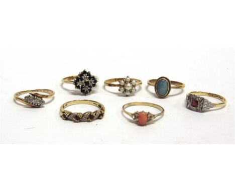 A COLLECTION OF SIX DRESS RINGS  stone set,  some in 9 carat hallmarked gold, 12.8g gross; and a synthetic ruby and diamond r