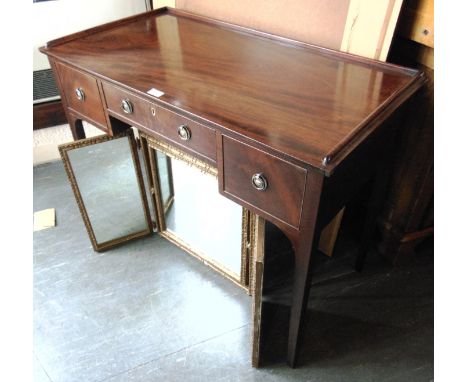 A MAHOGANY SIDE TABLE FITTED WITH THREE DRAWERS  and low three quarter gallery on square tapering supports, 97cm wide 51cm de