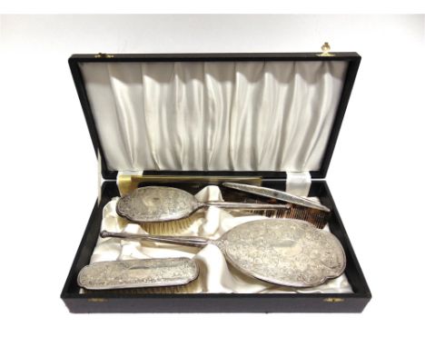 A CASED SILVER DRESSING TABLE SET by C.S. Green & Co, Birmingham 1966, comprising a hand mirror, hair brush, clothes brush an