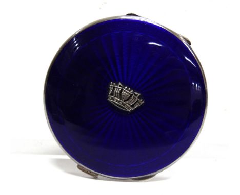 A SILVER AND ENAMEL POWDER COMPACT  possibly J.W. Barrett and Sons Ltd, Birmingham 1951, circular, dark blue guilloch cover w