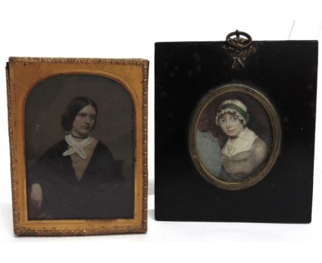 BRITISH SCHOOL (19TH CENTURY)  Lady in a Mob Cap, a portrait miniature,  watercolour, unsigned, 6cm x 5cm (oval), in an eboni