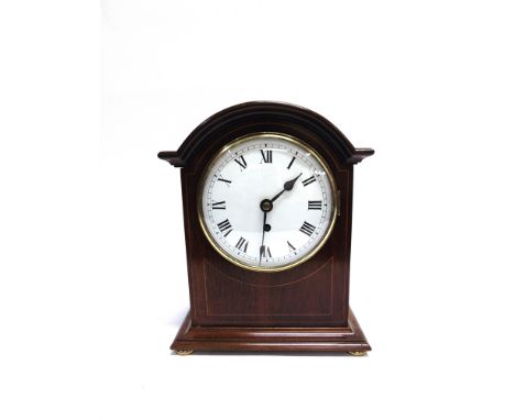 AN EDWARDIAN MAHOGANY CASED BRACKET CLOCK  with line inlaid decoration, the enamel dial with Roman numerals, 28cm wide 34cm h