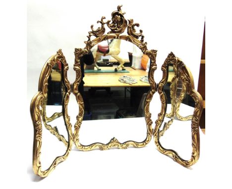 A GILT FRAMED TRIPTYCH DRESSING TABLE MIRROR  the central mirror 79cm high 46cm wide